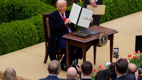 US President Donald Trump signs an executive order imposing tariffs on imported goods during a "Make America Wealthy Again" trade announcement event in the Rose Garden, at the White House, on April 2, 2025, in Washington, DC. (Andrew Harnik via Getty Images)