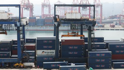 Shipping containers and cranes are seen at the port in Keelung, Taiwan, on April 9, 2025. (I-Hwa Cheng/AFP via Getty Images)