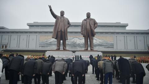 People pay tribute to the statues of late North Korean leaders Kim Il Sung and Kim Jong Il in Pyongyang on February 16, 2025. (Kim Won Jin via Getty Images)
