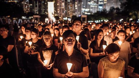 Participants take part at the candlelight vigil as they hold candles at Victoria Park on June 4, 2015, in Hong Kong. (Anthony Kwan via Getty Images)