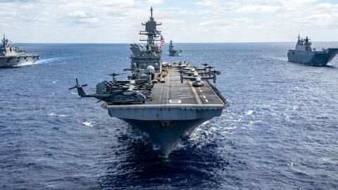 The amphibious assault ship USS America steams alongside other vessels from the US Navy, Royal Australian Navy, Republic of Korea Navy, Royal New Zealand Navy, French Navy, and Japan Maritime Self-Defense Force in the Coral Se on July 20, 2025. (US Navy photo)
