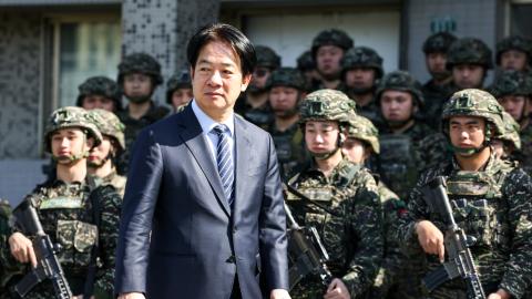 Taiwan’s President Lai Ching-te inspects troops taking part in the Rapid Response Exercise during a visit at the Songshan military airbase in Taipei on March 21, 2025. (I-Hwa Cheng via Getty Images)