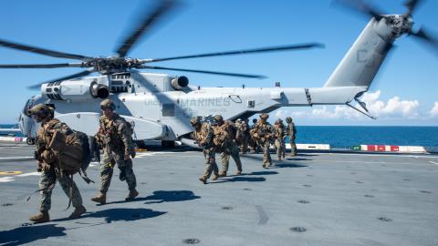US Marines embark on the amphibious transport dock ship USS Arlington from a CH-53K helicopter on September 25, 2025. (US Navy)
