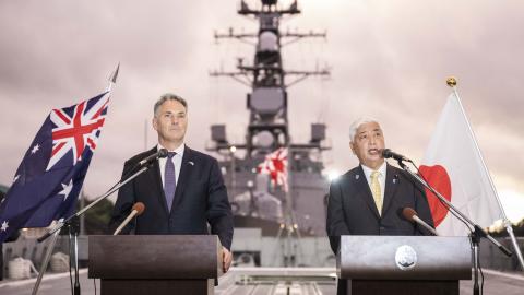 Australia’s Defence Minister Richard Marles and Japan’s Defence Minister General Nakatani shake hands ahead of a joint press announcement aboard the Japan Maritime Self-Defense Force Mogami-class stealth frigate JS Mikuma at the JMSDF naval base in Yokosuka, Japan, on September 5, 2025. (Getty Images)