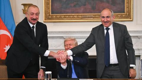 Azerbaijani President Ilham Aliyev, Armenian Prime Minister Nikol Pashinyan, and US President Donald Trump shake hands during a trilateral signing ceremony in the State Dining Room of the White House on August 8, 2025. (Getty Images)