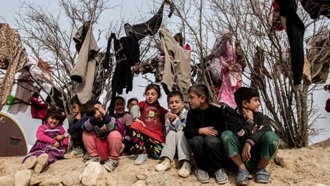 Yezidi children seen at a small IDP camp near Snyuy, an Iraqi city at the base of Mount Sinjar. (Sebastian Backhaus/NurPhoto via Getty Images)