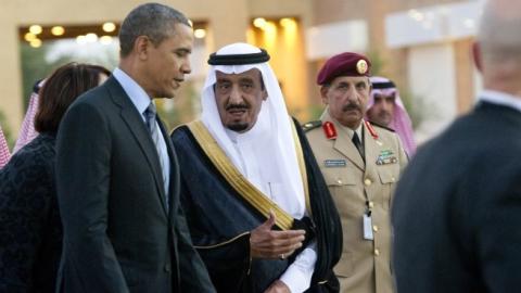 US President Barack Obama (C-L) is greeted by then-Saudi Crown Prince Salman bin Abdulaziz al-Saud (C-R) upon his arrival at Rawdat Khurayim on March 28, 2014. (SAUL LOEB/AFP/Getty Images)