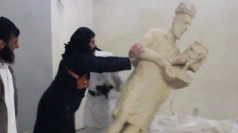 Screenshot of ISIS fighters destroying artifacts
