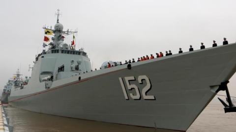 Soldiers of Chinese navy stand in line on the ship before they go to the Somalia Waters on April 3, 2015 in Zhoushan, China. (ChinaFotoPress via Getty Images)