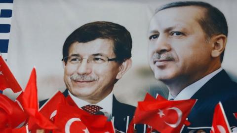 AK Party Supporters in front of the poster of then-Turkish PM Recep Tayyip Erdogan (R) and then-Turkish Foreign Minister Ahmet Davutoglu (L) in Ankara, Turkey on August 27, 2014. (Murat Kaynak/Anadolu Agency/Getty Images)