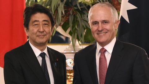 Australian Prime Minister Malcolm Turnbull (R) shakes hands with Japanese Prime Minister Shinzo Abe (L) before their meeting at the state guest house in Tokyo on December 18, 2015. (FRANCK ROBICHON/AFP/Getty Images)