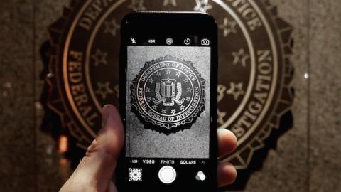 The official seal of the Federal Bureau of Investigation is seen on an iPhone's camera screen outside the J. Edgar Hoover headquarters, February 23, 2016 in Washington, DC. (Chip Somodevilla/Getty Images)
