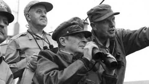 General of the Army Douglas MacArthur (1880 - 1964) (center fore, in leather jacket), and other American military commanders observe the shelling of Inchon during the Korean War, September 1950. (PhotoQuest/Getty Images)