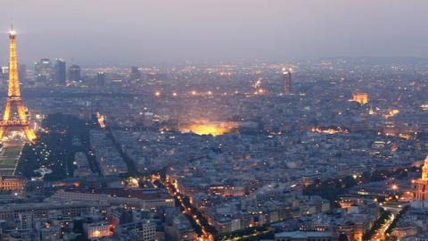 General view of Paris at dusk with the Eiffel Tower and the Hotel des Invalides prominent (Photo by Mike Hewitt/Getty Images)