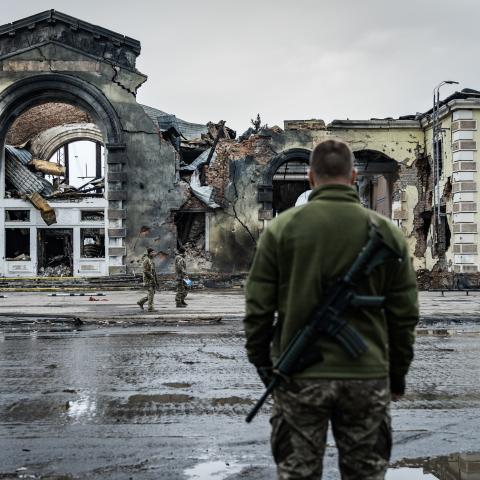 A Ukrainian soldier stands in front of railroad station destroyed by Russian shelling on March 15, 2024, in Kostiantynivka, Ukraine. (Photo by Serhii Mykhalchuk/Global Images Ukraine via Getty Images)