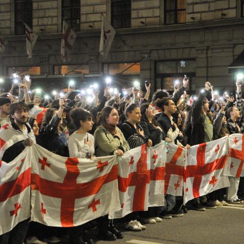  Demonstrators hold a Georgian flag during a protest against the “foreign agents” bill after the Georgian Parliament voted through the law on May 15, 2024, in Tbilisi, Georgia.