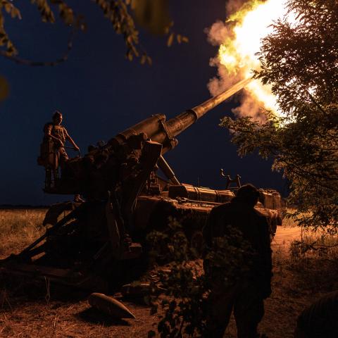 Ukrainian soldiers fire an artillery piece at their combat position in Donetsk Oblast, Ukraine, on July 26, 2024. (Photo by Diego Herrera Carcedo/Anadolu via Getty Images)