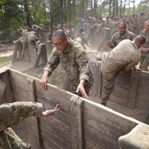 US Army trainees compete against each other on the Fit to Win obstacle course during basic training at Fort Jackson on September 28, 2022, in Columbia, South Carolina. (Scott Olson/Getty Images)