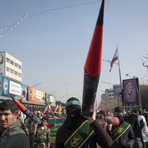 Members of the Basij paramilitary force under the command of the Islamic Revolutionary Guard Corps (IRGC) carry scale model missiles in a military rally in downtown Tehran, Iran, on January 10, 2025. (Photo by Morteza Nikoubazl/NurPhoto via Getty Images)