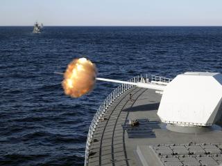 The main gun of Chinese guided-missile destroyer Nanchang attacks target during a China-Russia military drill on October 15, 2021, in Russia. (Sun Zifa/China News Service via Getty Images)