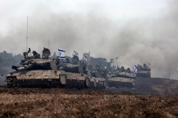 A unit of Israeli soldiers returns to the Israeli side of the border with the Gaza Strip on January 28, 2024. (Photo by Menahem Kahana/AFP via Getty Images)