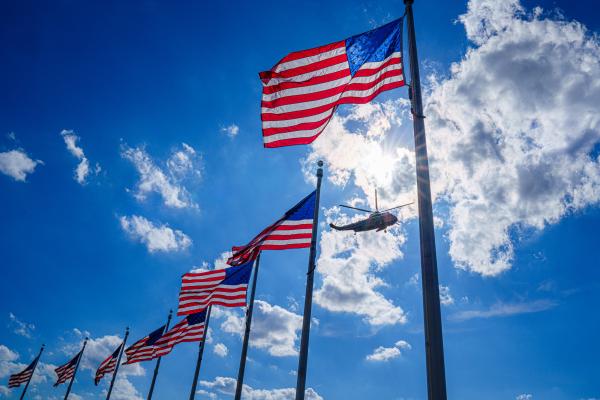 Marine One carrying Joe Biden flies past US Flags on April 18, 2024, in Washington, DC. (J. David Ake via Getty Images)