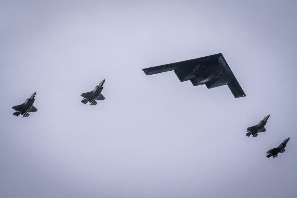 US Air Force F-35 Lighting IIs and a B-2 Spirit fly over Joint Base Elmendorf-Richardson, in Alaska on August 15, 2025. (US Air Force photo)