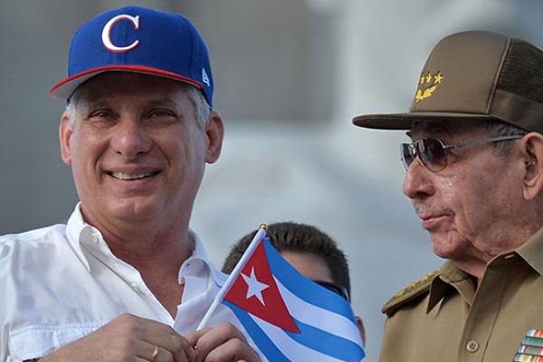 Cuban President Miguel Diaz-Canel (L) and former president Raul Castro attend the May Day rally at Revolution Square in Havana on May 1, 2018. 