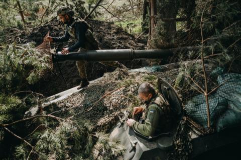 Soldiers from the Ukrainian 63rd Brigade hide an artillery unit in Donetsk Oblast, Ukraine, on April 13, 2024. (Wojciech Grzedzinski via Getty Images)