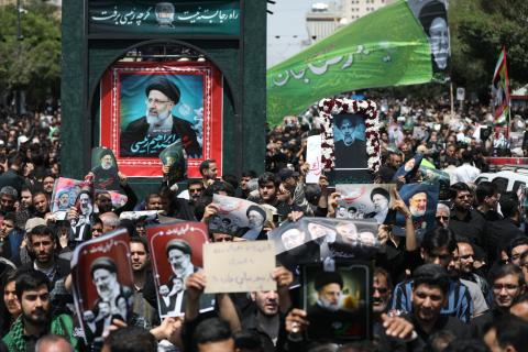 Mourners attend the funeral of Iran's President in Tehran on May 22, 2024. (Atta Kenare/AFP via Getty Images)
