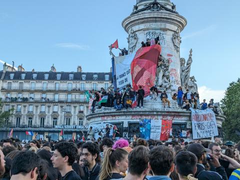 People celebrate the victory of the left-wing union after the French parliamentary elections in Paris, France, on July 7, 2024. (Luc Auffret/Anadolu via Getty Images)