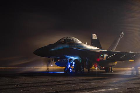 Sailors prepare an E/A-18G Growler for launch aboard the USS Dwight D. Eisenhower in the Red Sea on April 16, 2024. (DVIDS)