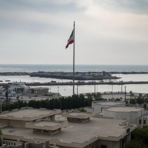 An Iranian flag waves on a beach in Bushehr, Iran, home to Iran's first nuclear seaport, on April 28, 2024. (Morteza Nikoubazl/NurPhoto via Getty Images)