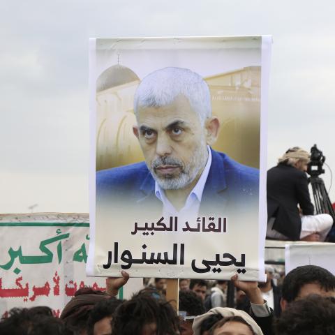 Yemen's Houthi followers hold placards depicting the Hamas leader Yahya Sinwar on August 9, 2024, in Sana'a, Yemen. (Mohammed Hamoud via Getty Images)