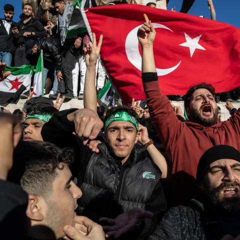 Syrians living in Turkey celebrate with opposition flags after Syrian rebels announced that they have ousted Bashar al-Assad on December 8, 2024, in Istanbul, Turkey. (Burak Kara via Getty Images)