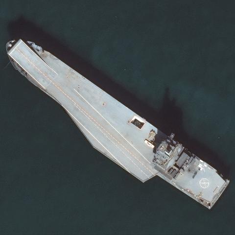 Maxar satellite imagery from December 12, 2024, of Iran's new drone ship (known as the Shahid Bagheri) is anchored offshore of the Iranian naval port of Bandar Abbas in the Persian Gulf. (Maxar Technologies via Getty Images)