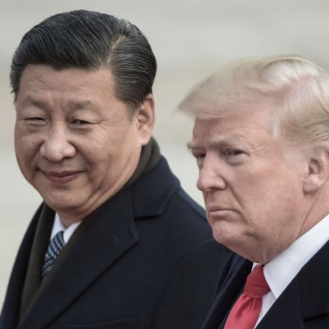 China's President Xi Jinping (L) and US President Donald Trump attend a welcome ceremony at the Great Hall of the People in Beijing on November 9, 2017. / AFP PHOTO / FRED DUFOUR (Photo credit should read FRED DUFOUR/AFP via Getty Images)